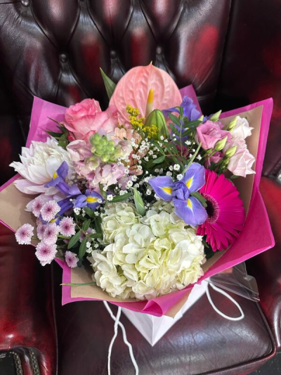 Blushing Bouquet - A beautifully balanced bouquet bursting with soft charm and vibrant highlights. Featuring delicate pinks, creamy whites, and pops of bold colour, this arrangement blends classic elegance with a fresh, modern feel.

Perfect for birthdays, thank-yous, or simply because, this hand-tied bouquet is thoughtfully arranged by Primrose Florist to bring joy, warmth, and a personal touch to every moment.